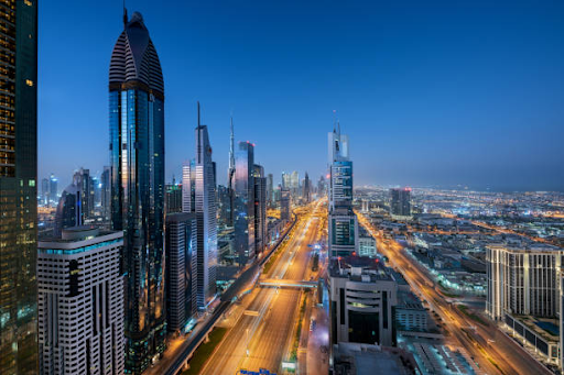 Skyline view of Dubai's bustling business district comparing Ajman Free Zone licenses to other UAE free zones.